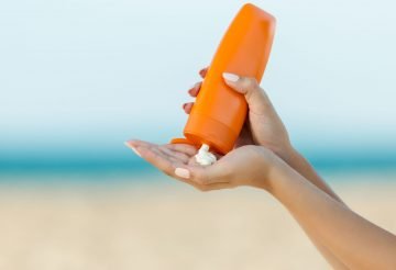 squeezing sunscreen
